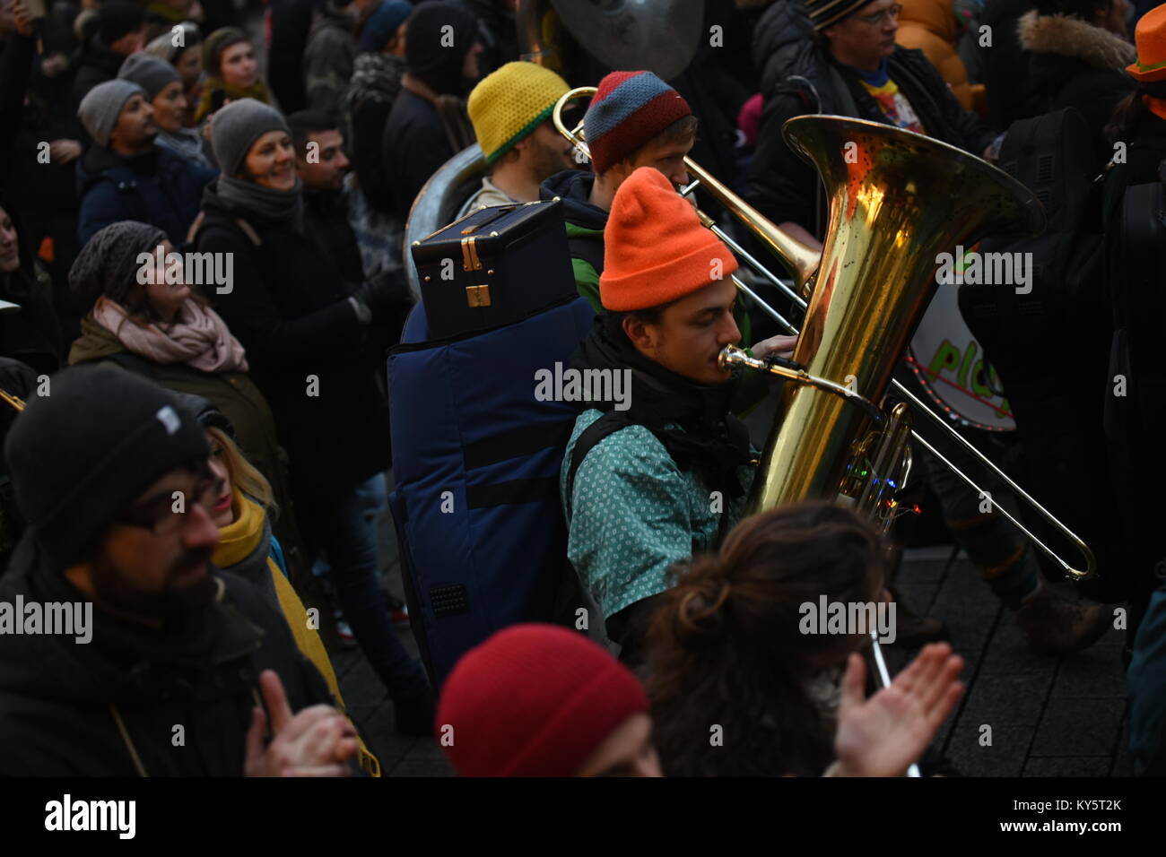 Vienna, Austria. 13th Jan, 2018. musician plays while marching  during an anti-government demonstration. Credit: Vincent Sufiyan/Alamy Live News Stock Photo