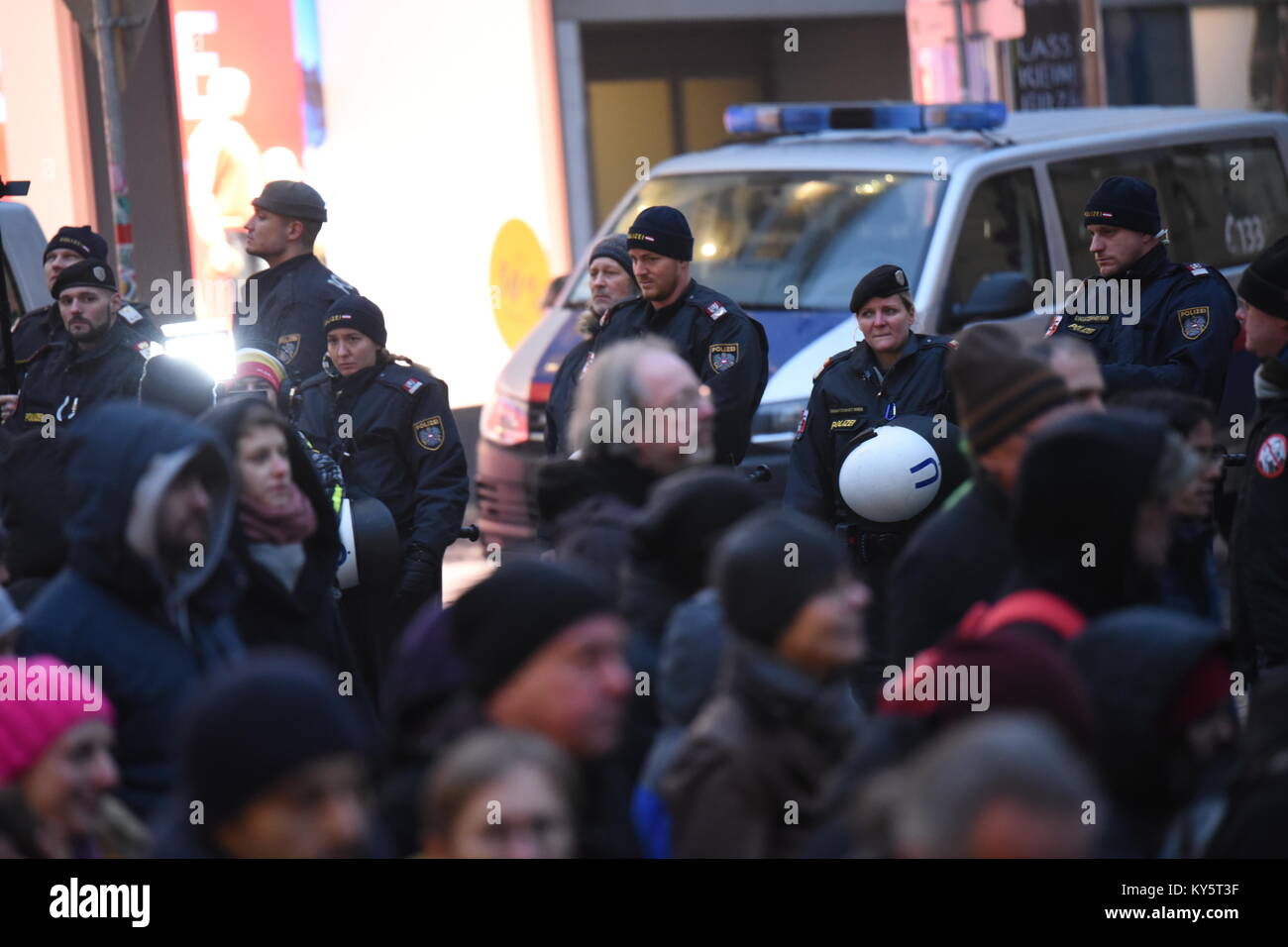 Vienna, Austria. 13th Jan, 2018. police officers guard the protest march through Vienna's main shopping street during an anti-government demonstration. Credit: Vincent Sufiyan/Alamy Live News Stock Photo