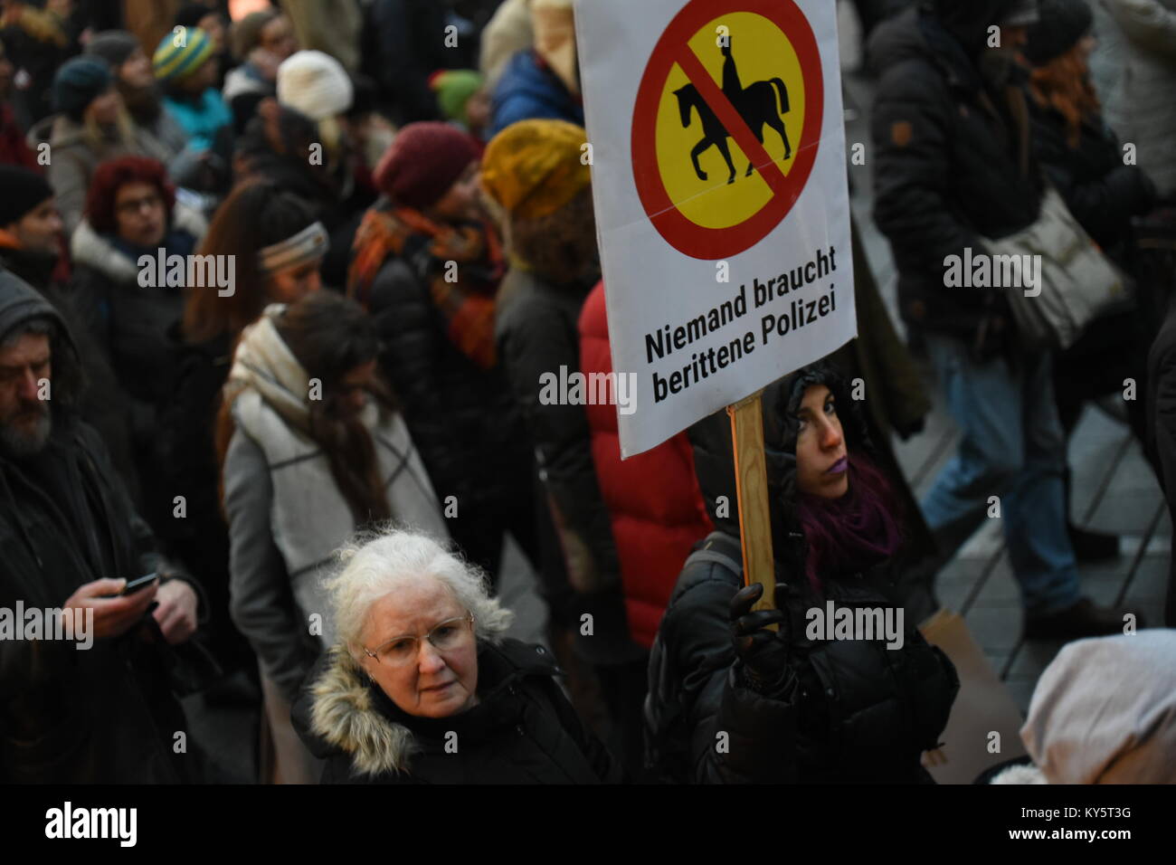 Vienna, Austria. 13th Jan, 2018. protester holding a sign reading 'nobody needs mounted police', a suggestion made by Austria's interior minister Herbert Kickl. Credit: Vincent Sufiyan/Alamy Live News Stock Photo