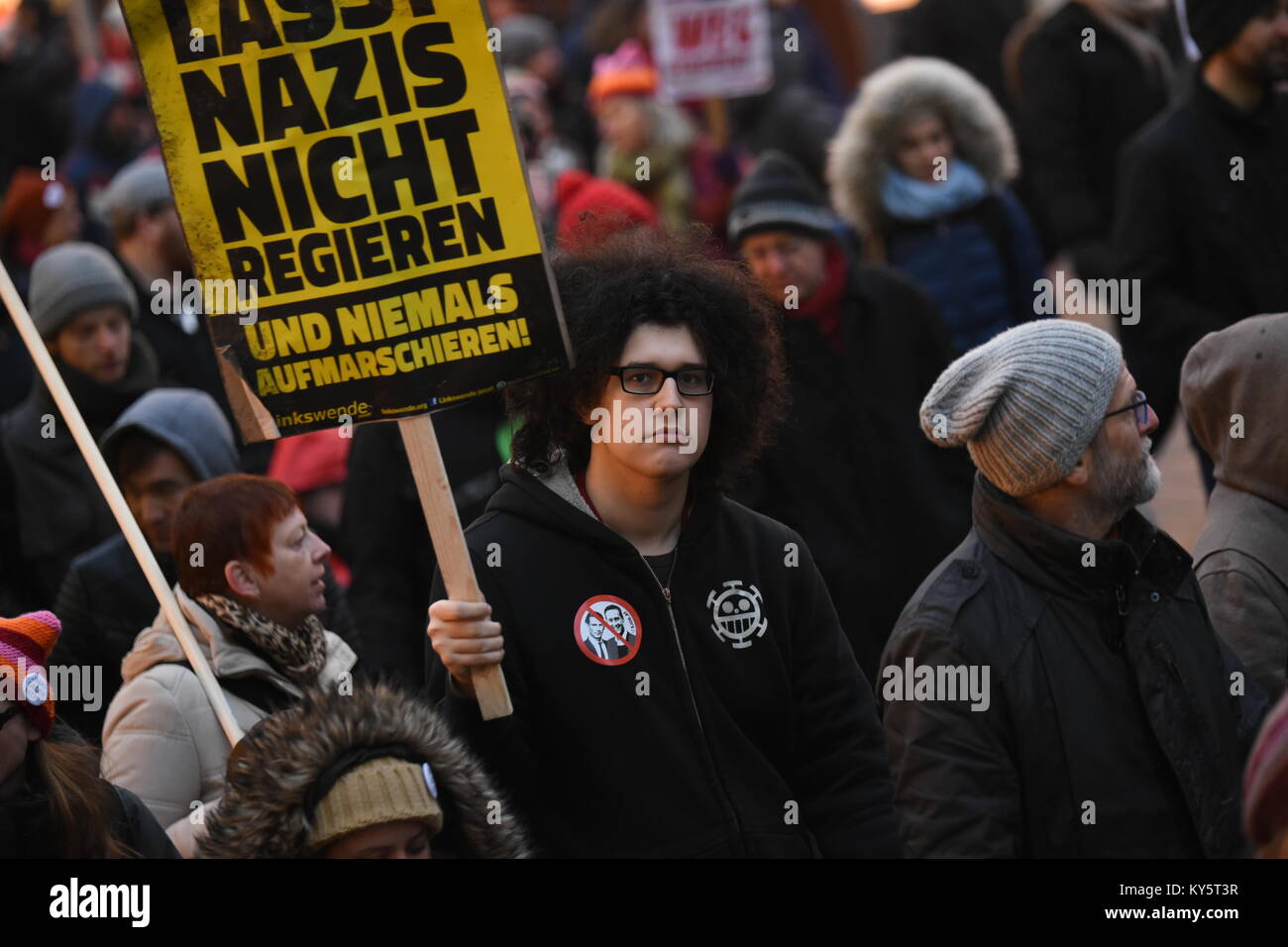 Vienna, Austria. 13th Jan, 2018. protester carrying a sign during an anti-government demonstration. the sign reads 'don't let Nazis into government'. Credit: Vincent Sufiyan/Alamy Live News Stock Photo
