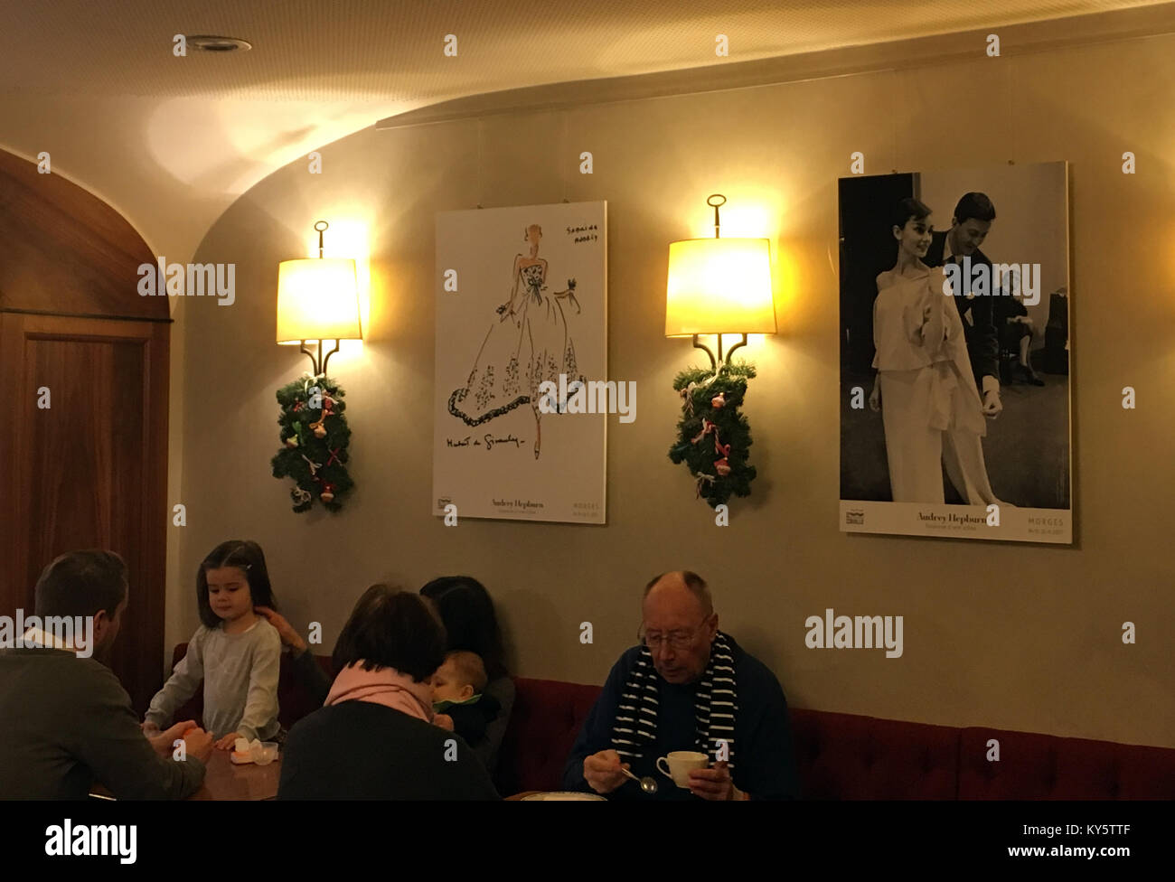 Morges, Switzerland. 07th Jan, 2018. Posters in a café depicting the actress Audrey Hepburn, who enjoyed shopping there, in Morges, Switzerland, 07 January 2018. Hepburn died aged 63 in Switzerland, where she had been living for more than 30 years. Credit: Christiane Oelrich/dpa/Alamy Live News Stock Photo