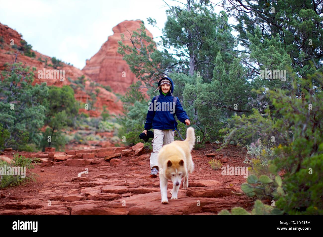 A boy and his dog hiking Stock Photo