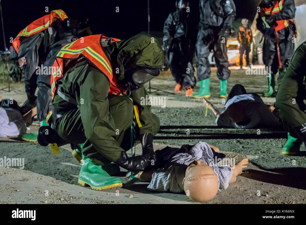 U.S. Army Soldier assesses simulated casualties during a Mass Casualty Decontamination exercise at the Homestead-Miami Speedway, in Miami-Dade, Florida, Jan. 9, 2018. This is the 3rd in a series of joint training exercises between Active Duty, Guard, and Reserve Army units and local municipalities across the United States. This JTE focused on the decontamination and transportation of casualties in a simulated mass chemical attack. (DoD Stock Photo
