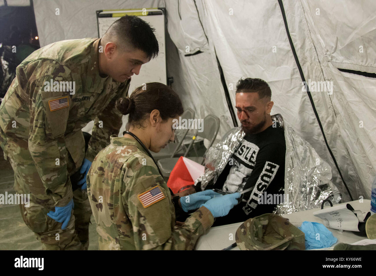 U.S. Army Soldier triage simulated casualties during a Mass Casualty Decontamination exercise at the Homestead-Miami Speedway, in Miami-Dade, Florida, Jan. 9, 2018. This is the 3rd in a series of joint training exercises between Active Duty, Guard, and Reserve Army units and local municipalities across the United States. This JTE focused on the decontamination and transportation of casualties in a simulated mass chemical attack. (DoD Stock Photo