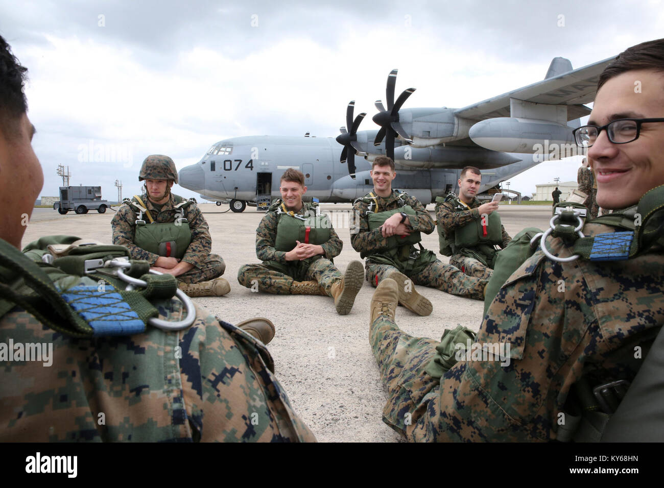 Marines with Air Delivery Platoon, Landing Support Company, 3rd Transportation Support Battalion, wait to board a C-130 at Kadena Air Force Base, Okinawa, Japan, Jan. 10, 2018. The Marines with LS Co. conducted air delivery operations as a part of regularly scheduled training at Ie Shima Island, which included cargo drops and personnel parachute jump exercises. (U.S. Marine Corps Stock Photo