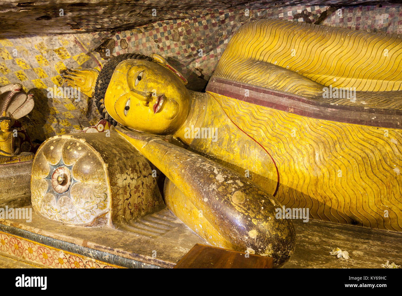 DAMBULLA, SRI LANKA - FEBRUARY 17, 2017: Sculpture of reclining Buddha inside Dambulla Cave Temple. Cave Temple is a World Heritage Site near Dambulla Stock Photo