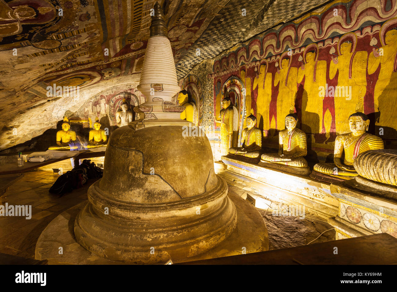DAMBULLA, SRI LANKA - FEBRUARY 17, 2017: Stupa or dagoba and Buddha statues inside Dambulla Cave Temple. Cave Temple is a World Heritage Site near Dam Stock Photo