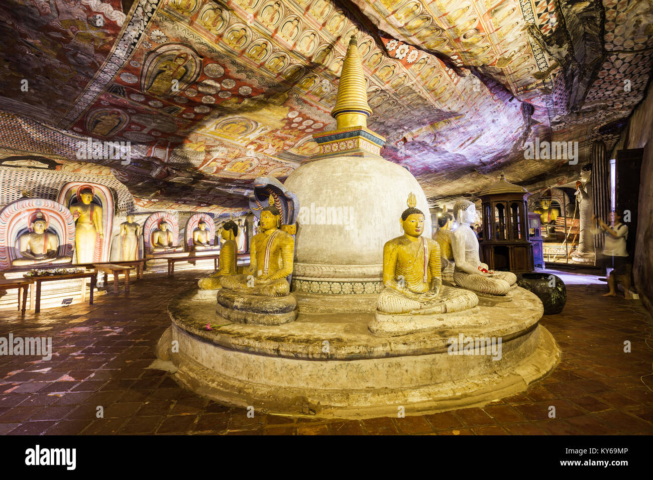 DAMBULLA, SRI LANKA - FEBRUARY 17, 2017: Stupa or dagoba and Buddha statues inside Dambulla Cave Temple. Cave Temple is a World Heritage Site near Dam Stock Photo