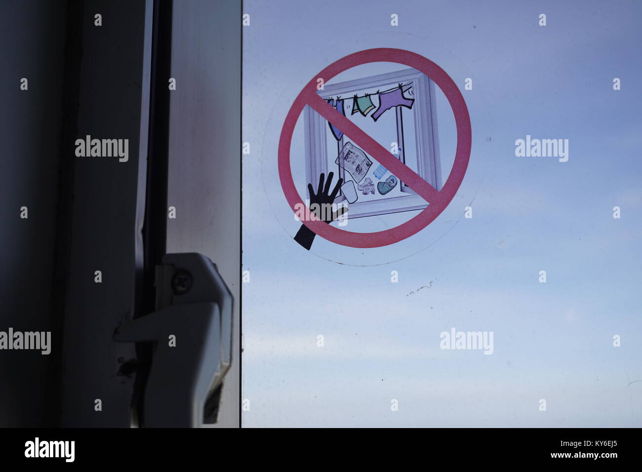 Do not throw rubbish or hang laundry outside window Stock Photo