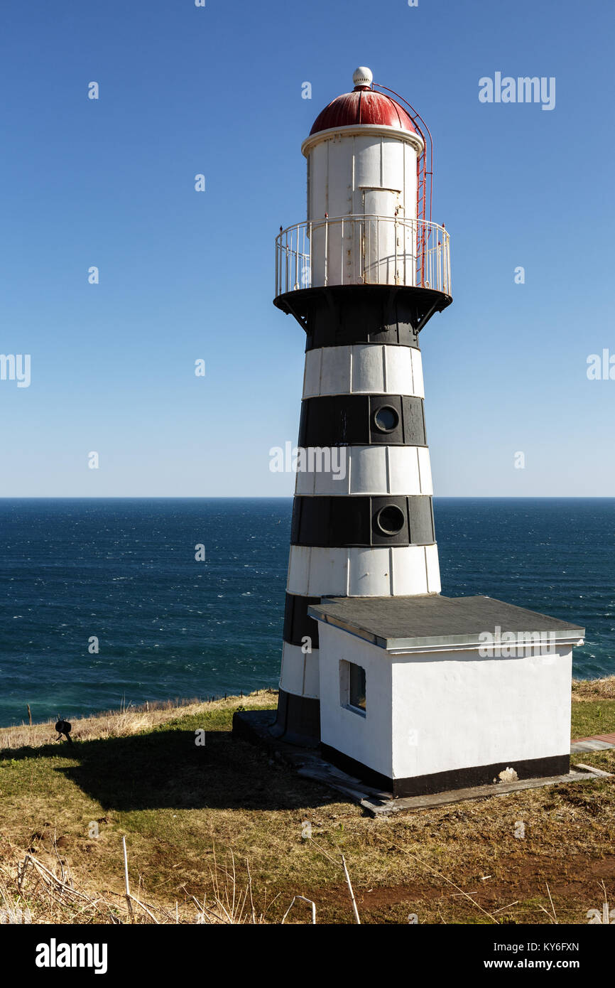 Petropavlovsky Lighthouse - oldest lighthouse in Russian Far East, located on Cape Mayachny on Kamchatka on shore of Avacha Gulf in Pacific Ocean Stock Photo