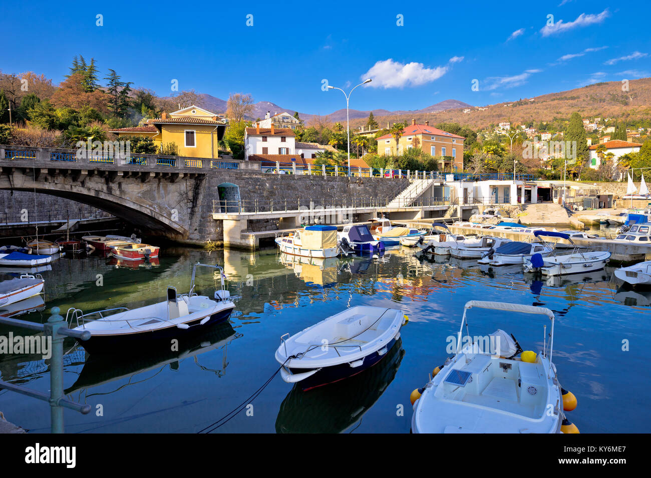 Icici village waterfront and harbor in Opatija riviera, turquoise sea and blue sky, Kvarner, Croatia Stock Photo