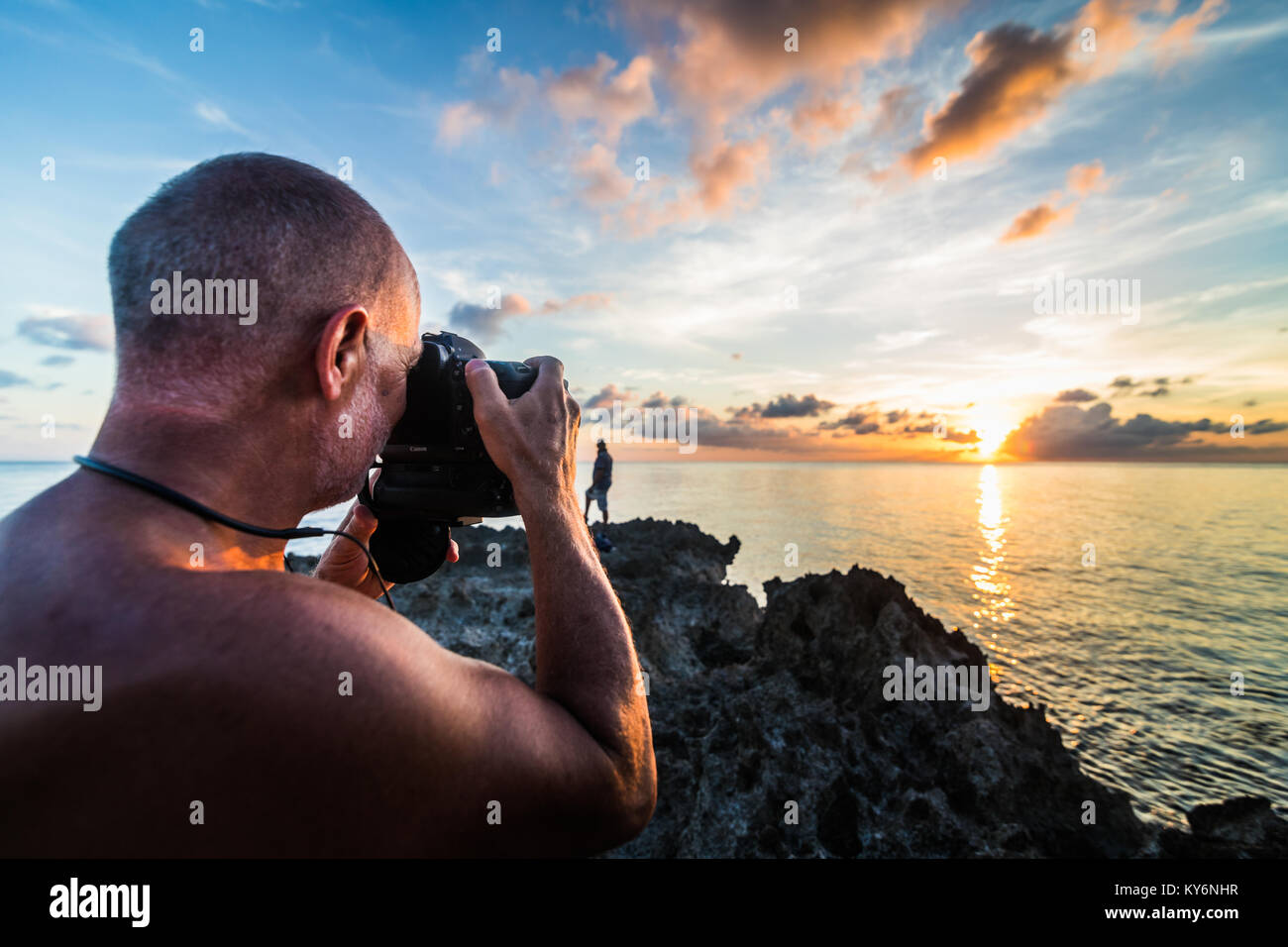 SAN ANDRES ISLAND, Colombia   Circa March 2017. Photographer Documenting a Beautiful Sunset in the Caribbean Stock Photo