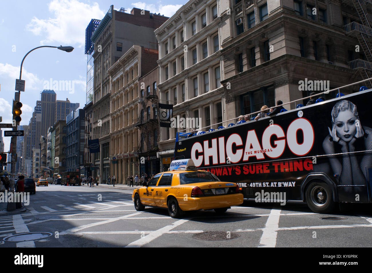 Tour bus with tourists sightseeing in New York City, NYC. Chicago the musical advertising. New York City Manhattan USA Stock Photo