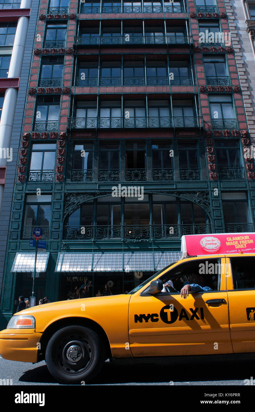 Yellow Cab in Mango store on Broome Street in Singer building in SoHO in Manhattan New York streets Stock Photo