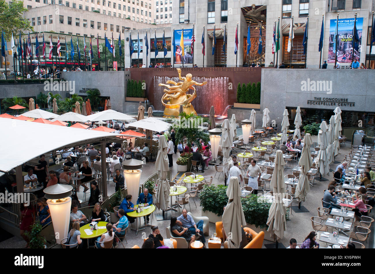 Bars and restaurants in Rockefeller Center and Prometheus statue in Manhattan, New York City, New York, USA. Stock Photo
