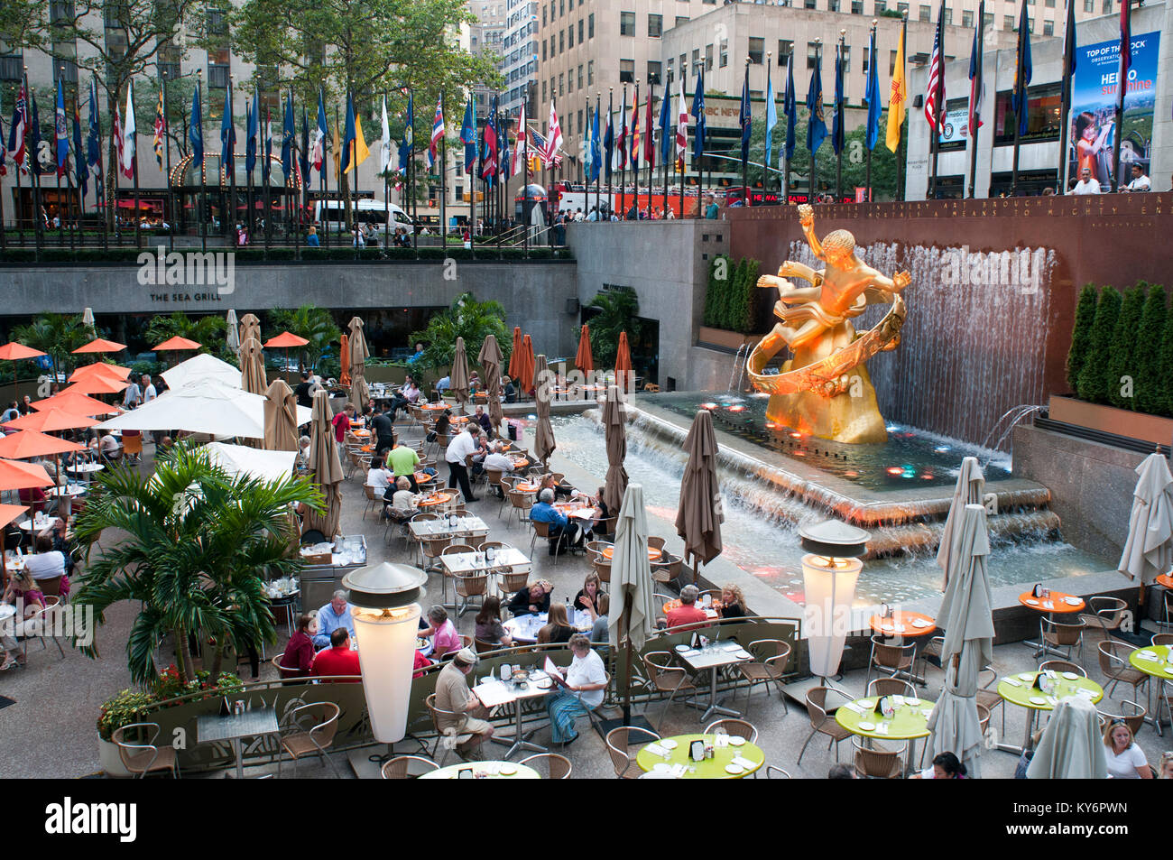 Bars and restaurants in Rockefeller Center and Prometheus statue in Manhattan, New York City, New York, USA. Stock Photo