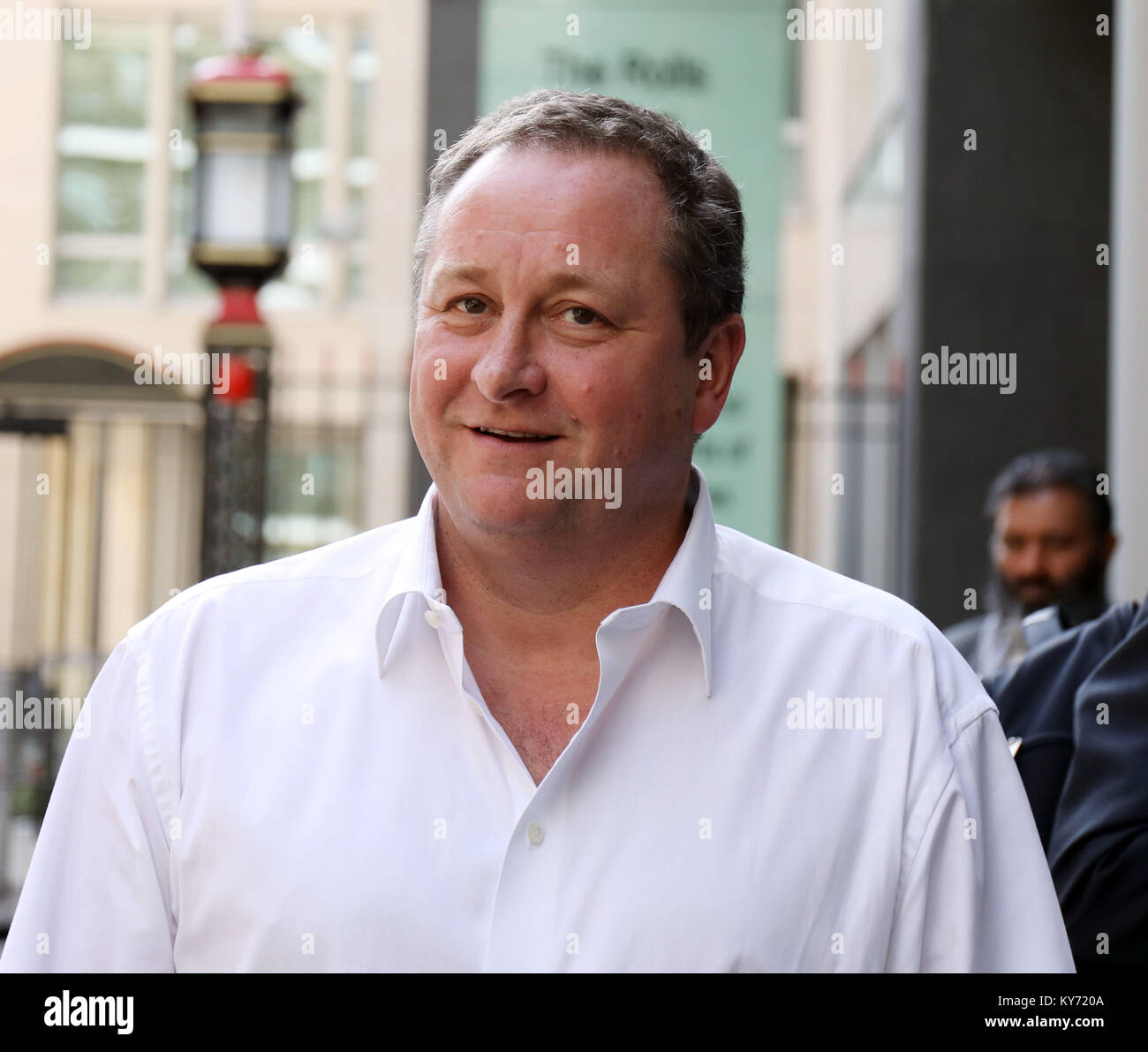 Pic shows: Mike Ashley  - Jeff Blue case at the High Court in London.  Mike Ashley leaving the High Court with his PR and legal team   Pic by Gavin Ro Stock Photo