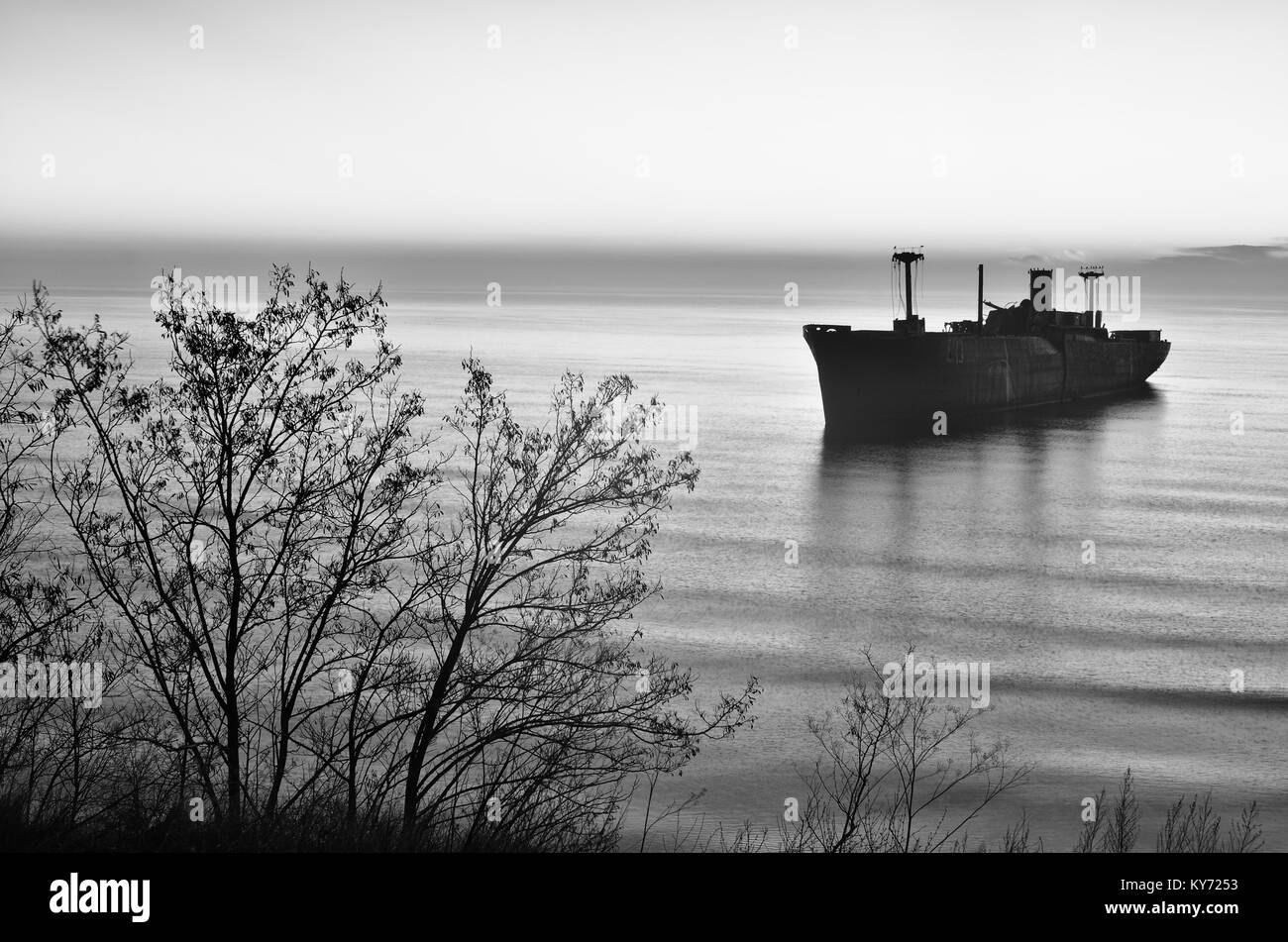 Beautiful sunrise haze  with a greek shipwreck Evangelia on the shore of Black Sea near Costinesti, Romania. Stock Photo
