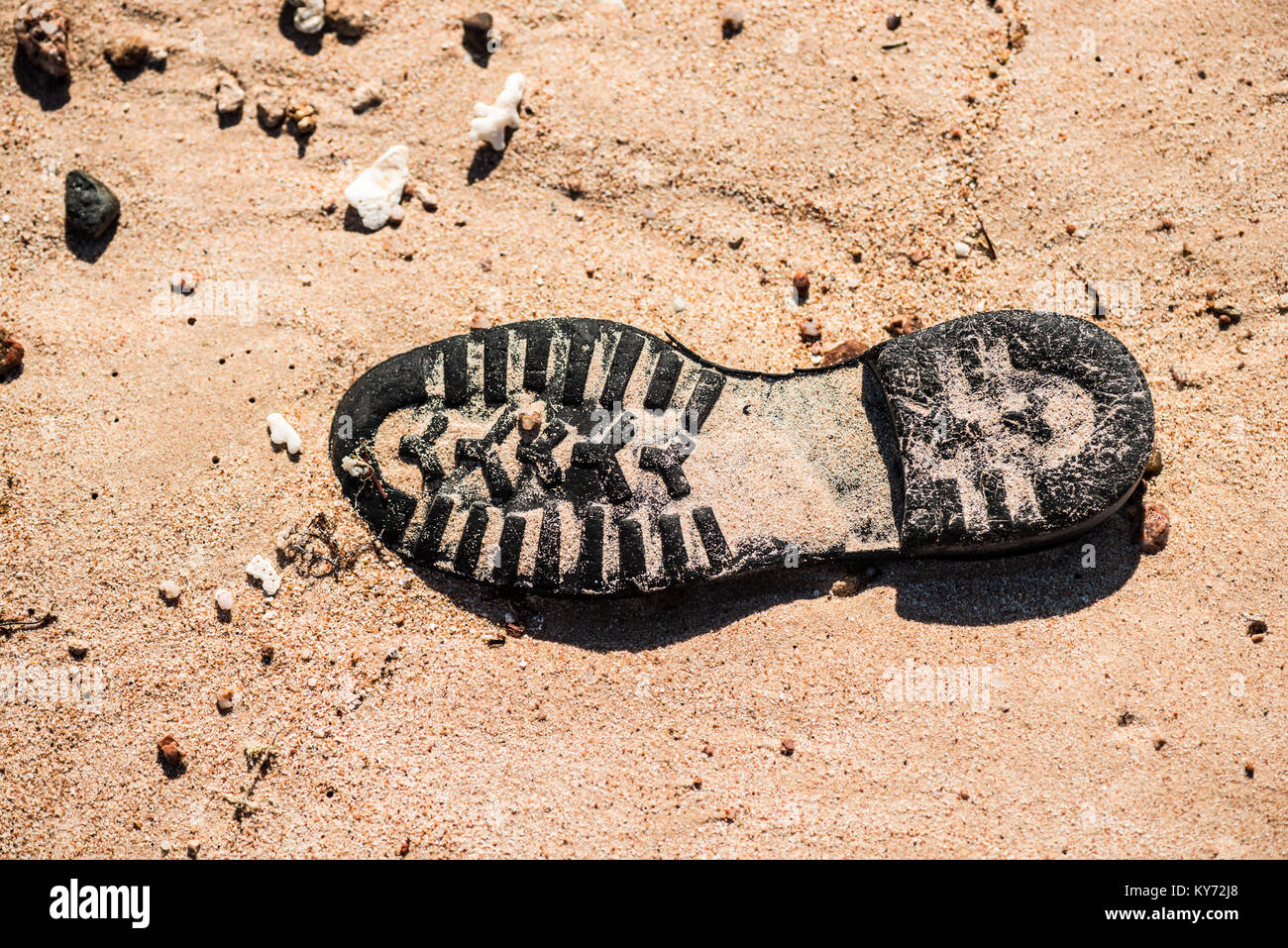 Old shoe sole on the sand in desert Stock Photo - Alamy