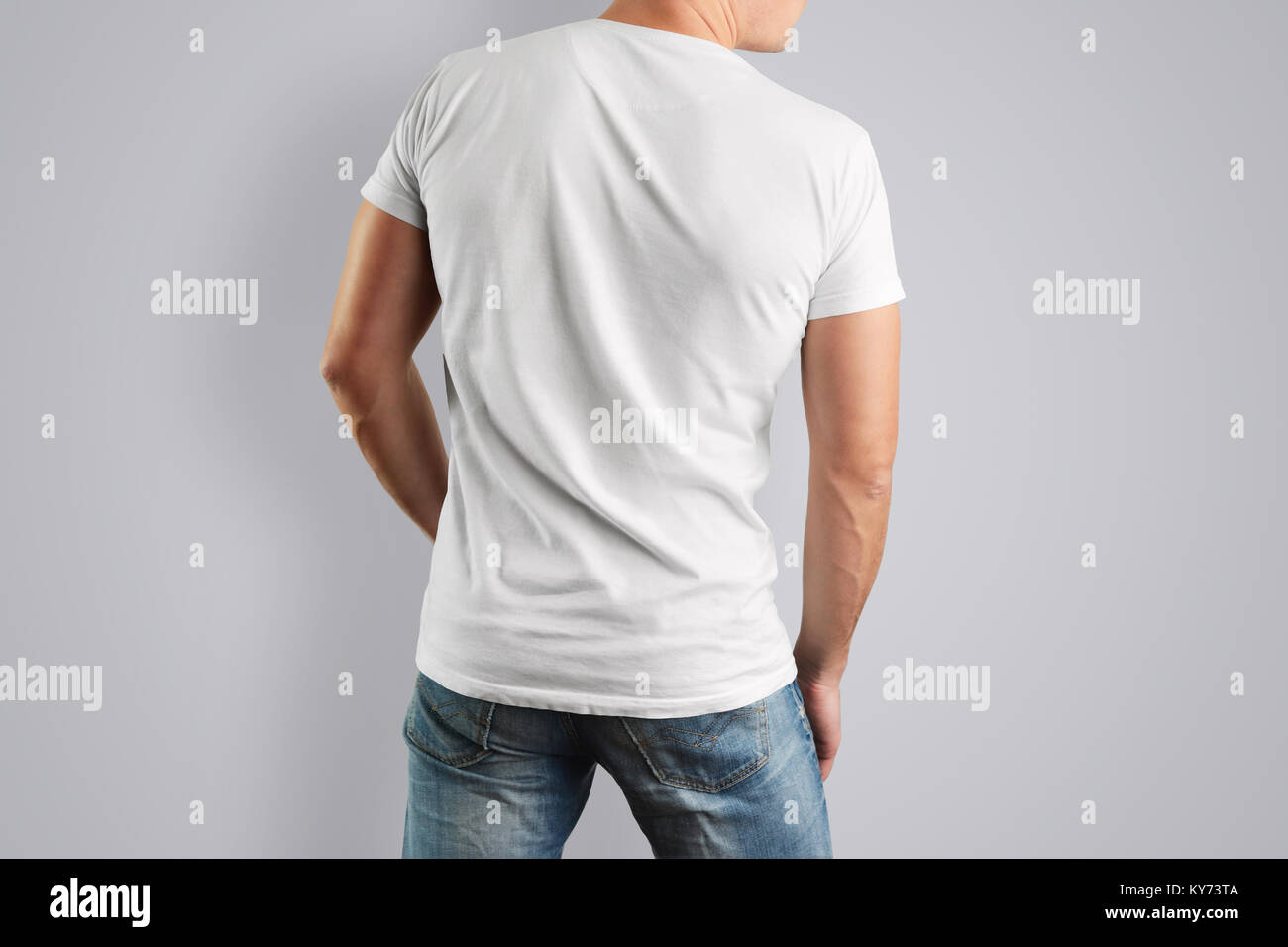 Download Mockup White T Shirt With A Back View On A Muscular Man With Blue Jeans Template For The Design Of Clothes Stock Photo Alamy