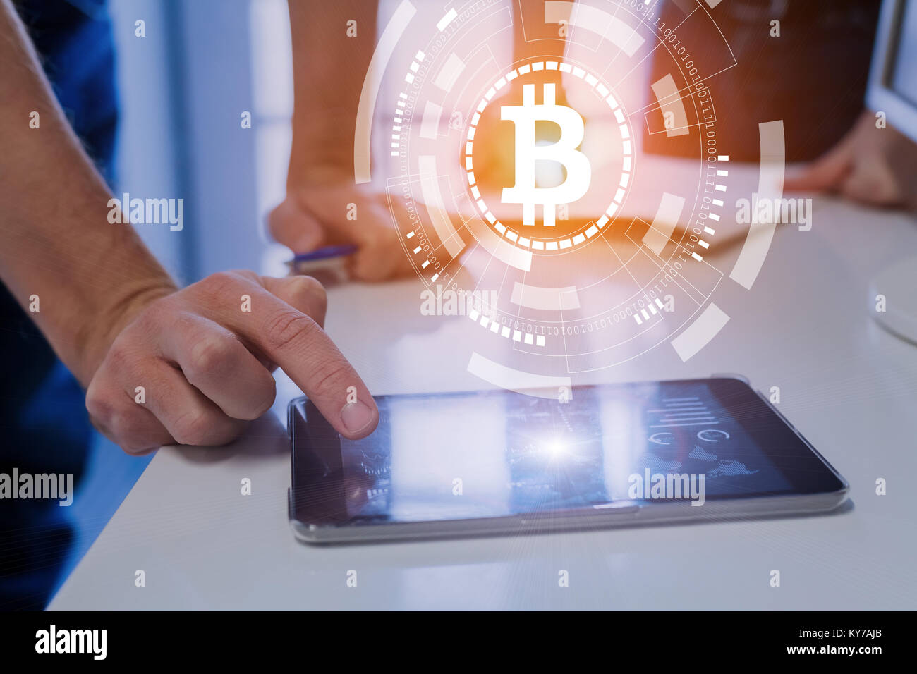 Team of financial people trading, investing or paying with bitcoin cryptocurrency technology, BTC currency symbol on virtual interface, digital tablet Stock Photo