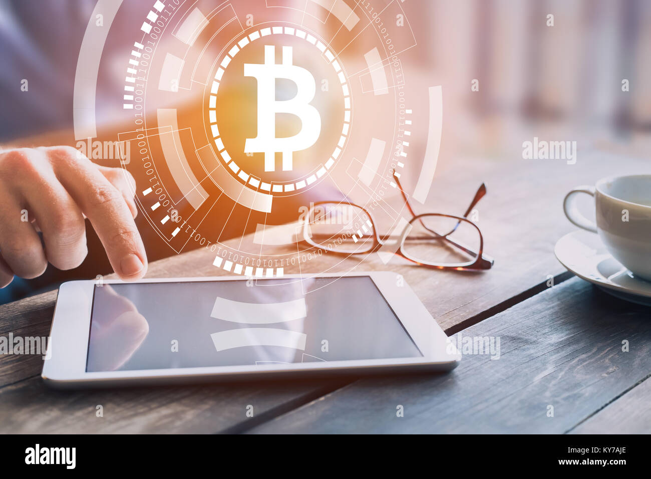 Bitcoin blockchain cryptocurrency technology concept with businessman investing, trading or paying on digital tablet computer with virtual interface w Stock Photo