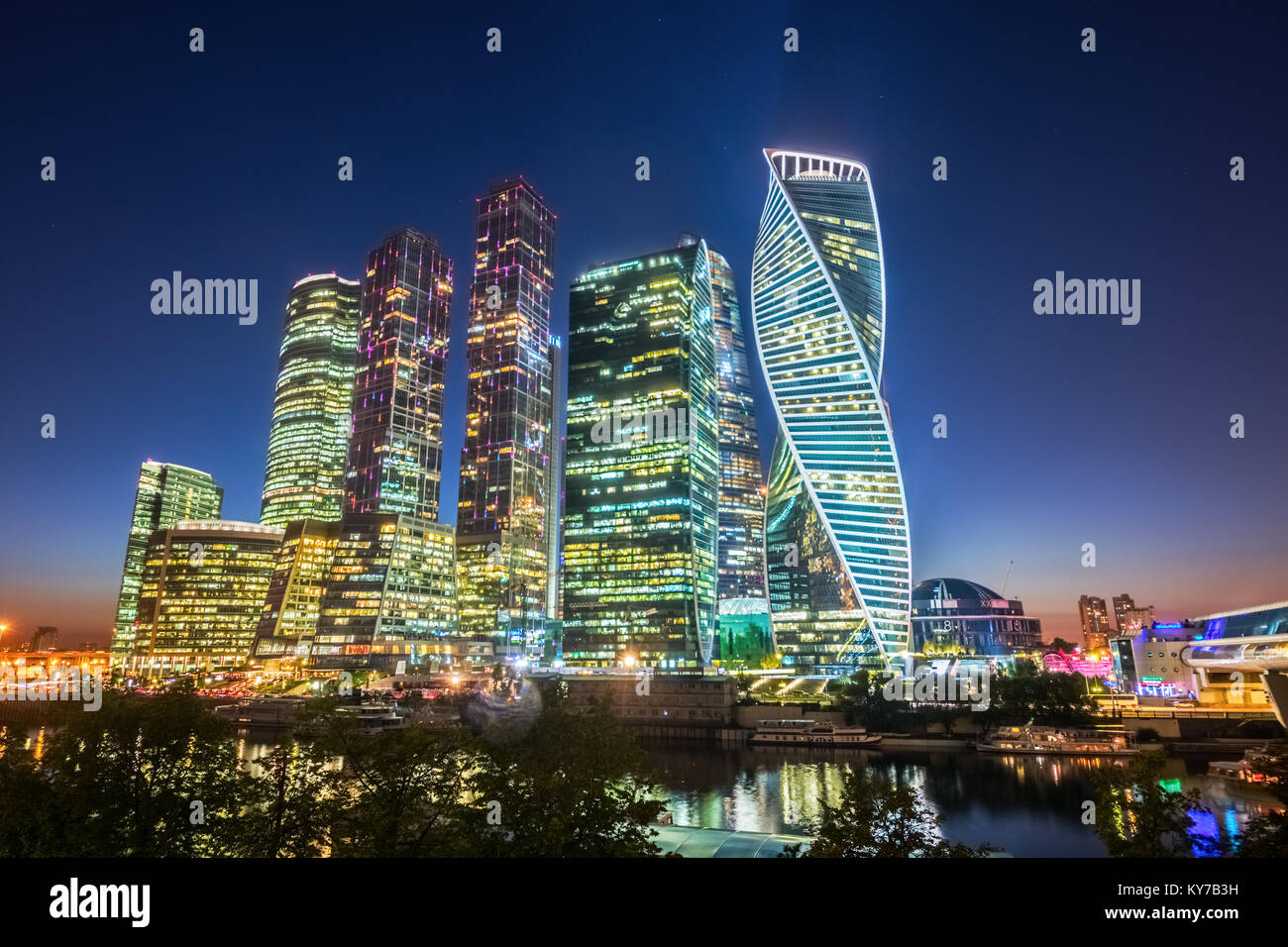 Futuristic skyscrapers of the Moscow International Business Center (MIBC), also named 'Moscow City', at the Moskva River during sunset. Russia. Stock Photo