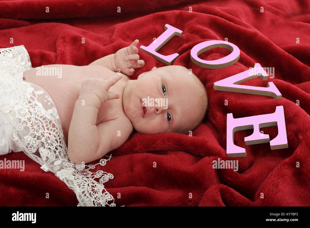 3 week old baby girl relaxing on blanket Stock Photo Alamy