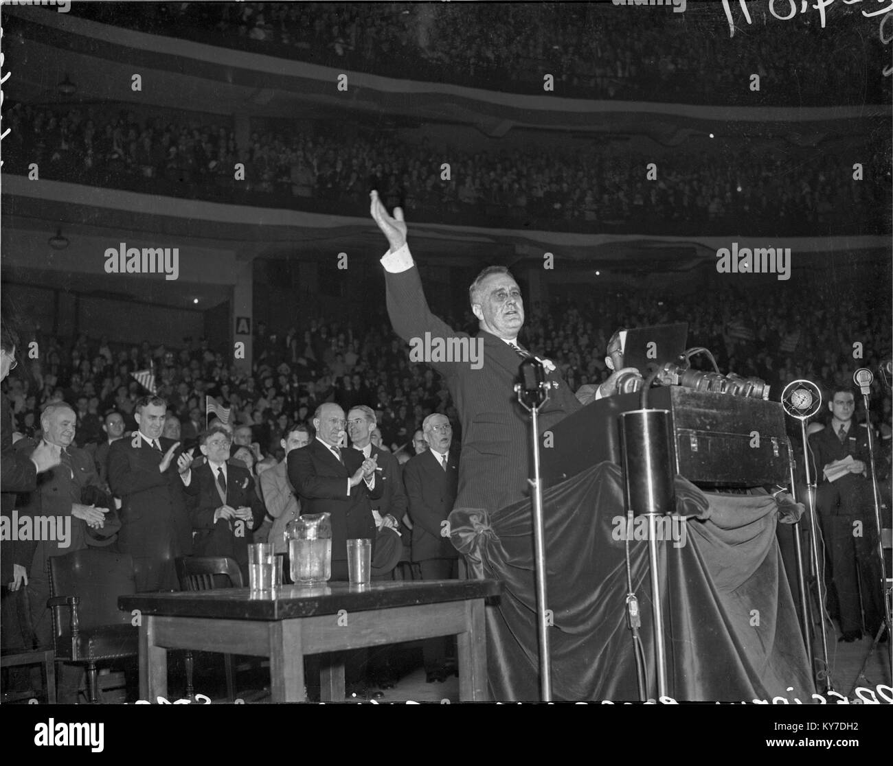 Franklin Roosevelt addressing the American Legion Convention at the Chicago Stadium, Chicago, Illinois. Illinois Governor Henry Horner is clapping in background.  October 2, 1933. Stock Photo