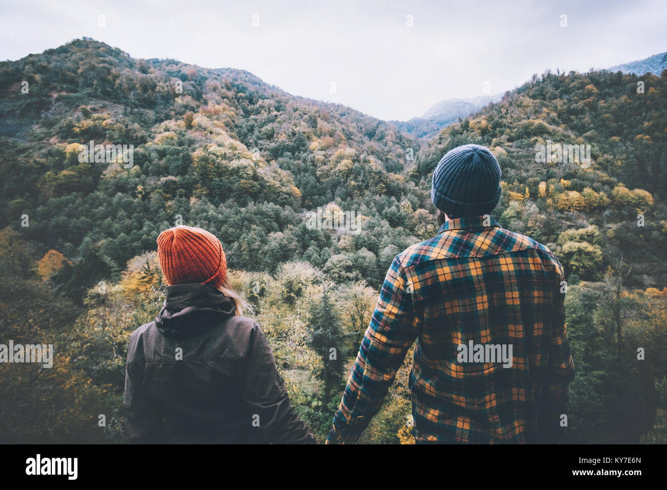 Couple Man and Woman in love together holding hands standing on bridge ...