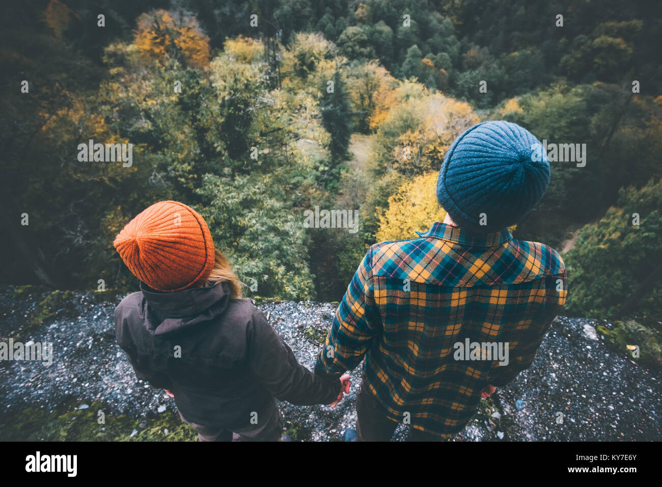 Couple Man and Woman in love together holding hands standing on bridge ...