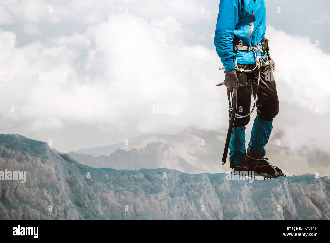 Man climbing on glacier to mountain summit Travel Lifestyle concept adventure active vacations