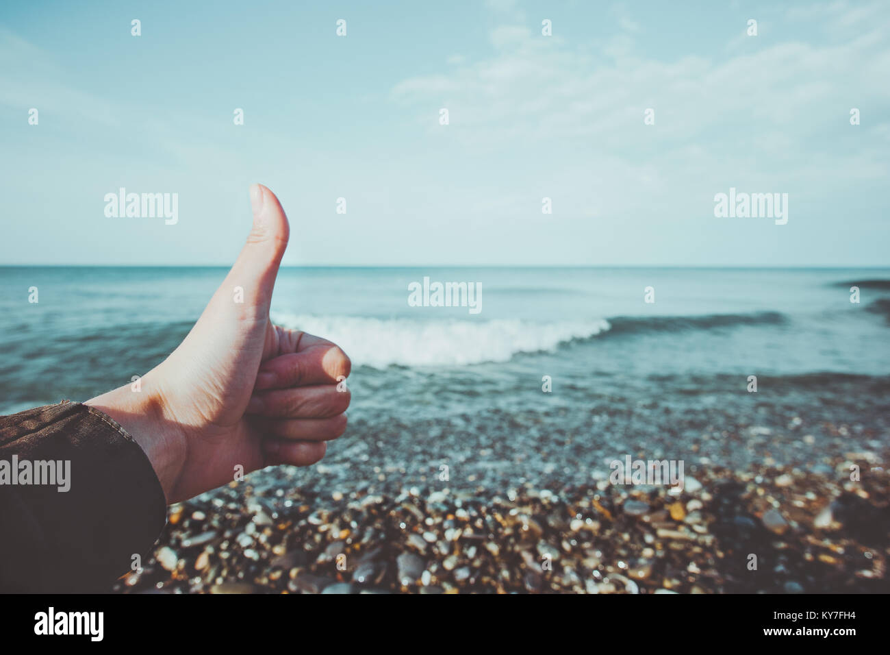 Hand showing like emotions and Sea summer Landscape Travel Lifestyle calm and tranquility scenic view summer vacations Stock Photo