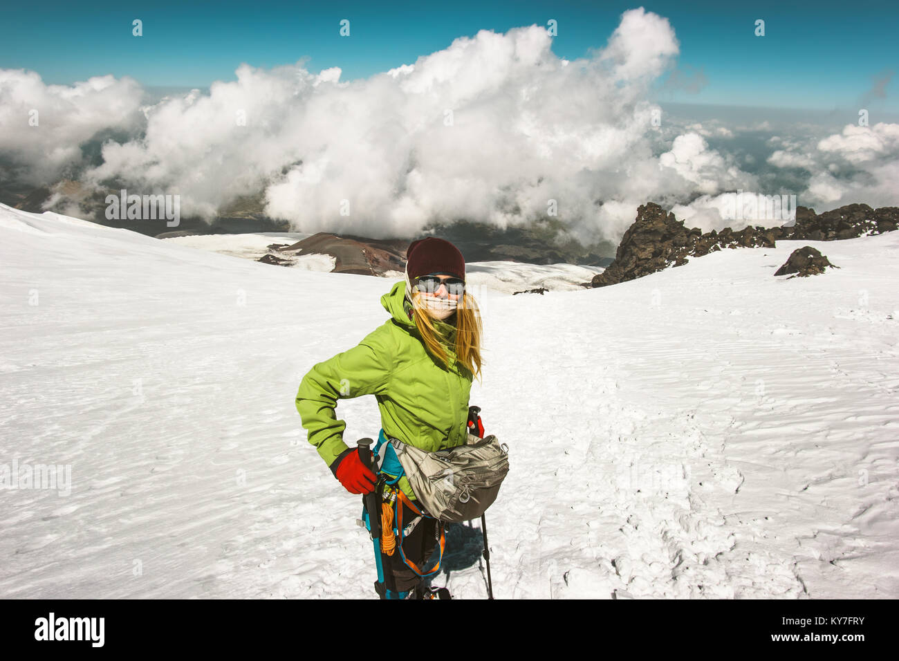 Woman alpinist climbing in mountains glacier Travel Lifestyle success concept adventure active