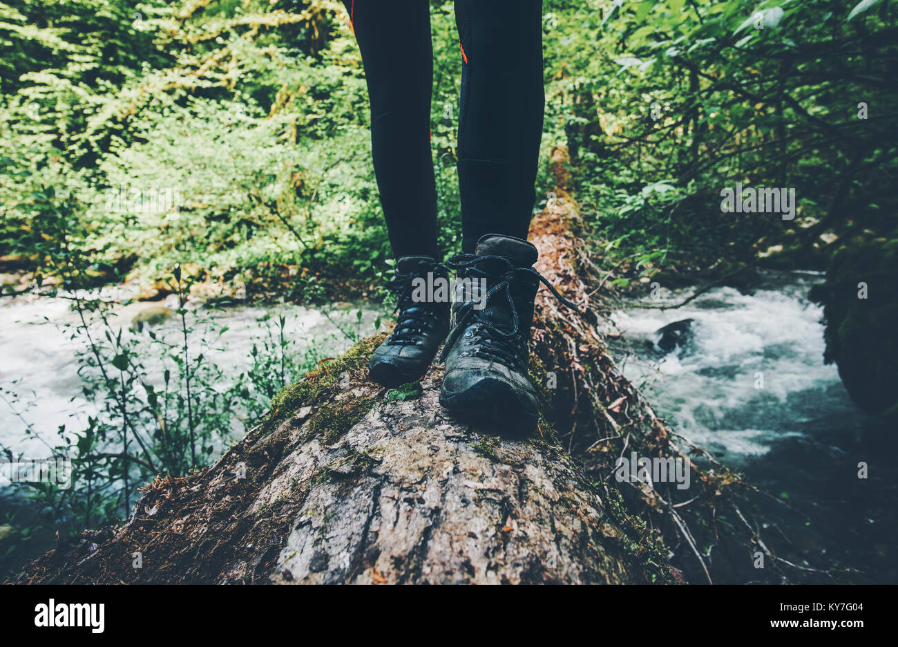 Feet trekking boots Traveler alone crossing over river on woods outdoor in  wild forest Lifestyle Travel extreme survival concept summer adventure vaca  Stock Photo - Alamy