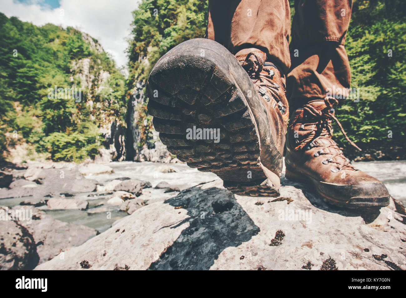 Feet trekking boots hiking Traveler alone outdoor wild nature Lifestyle Travel extreme survival concept summer adventure vacations steps sole view fro Stock Photo Alamy