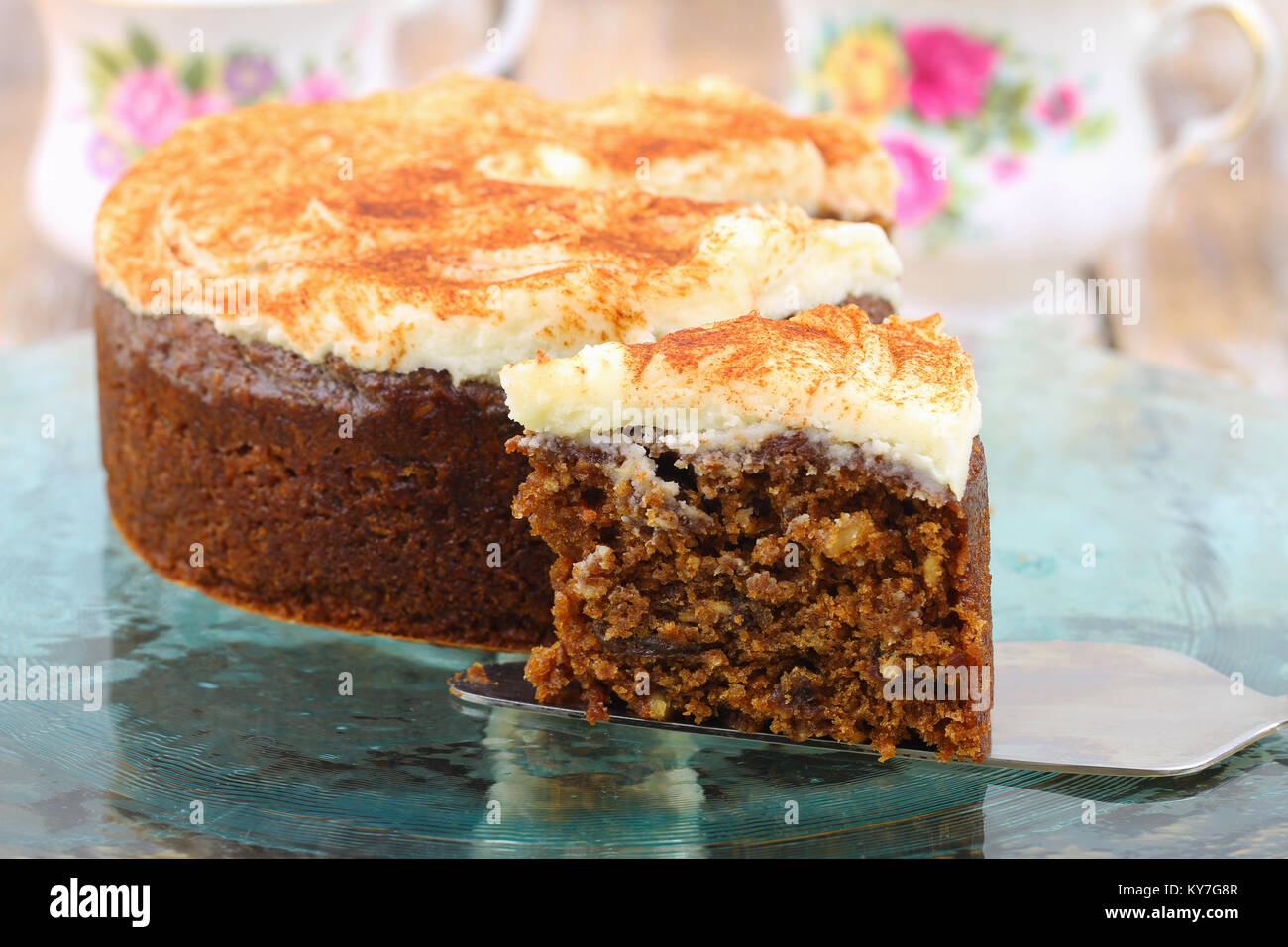 Slice of delicious carrot cake with walnuts with marzipan icing Stock Photo