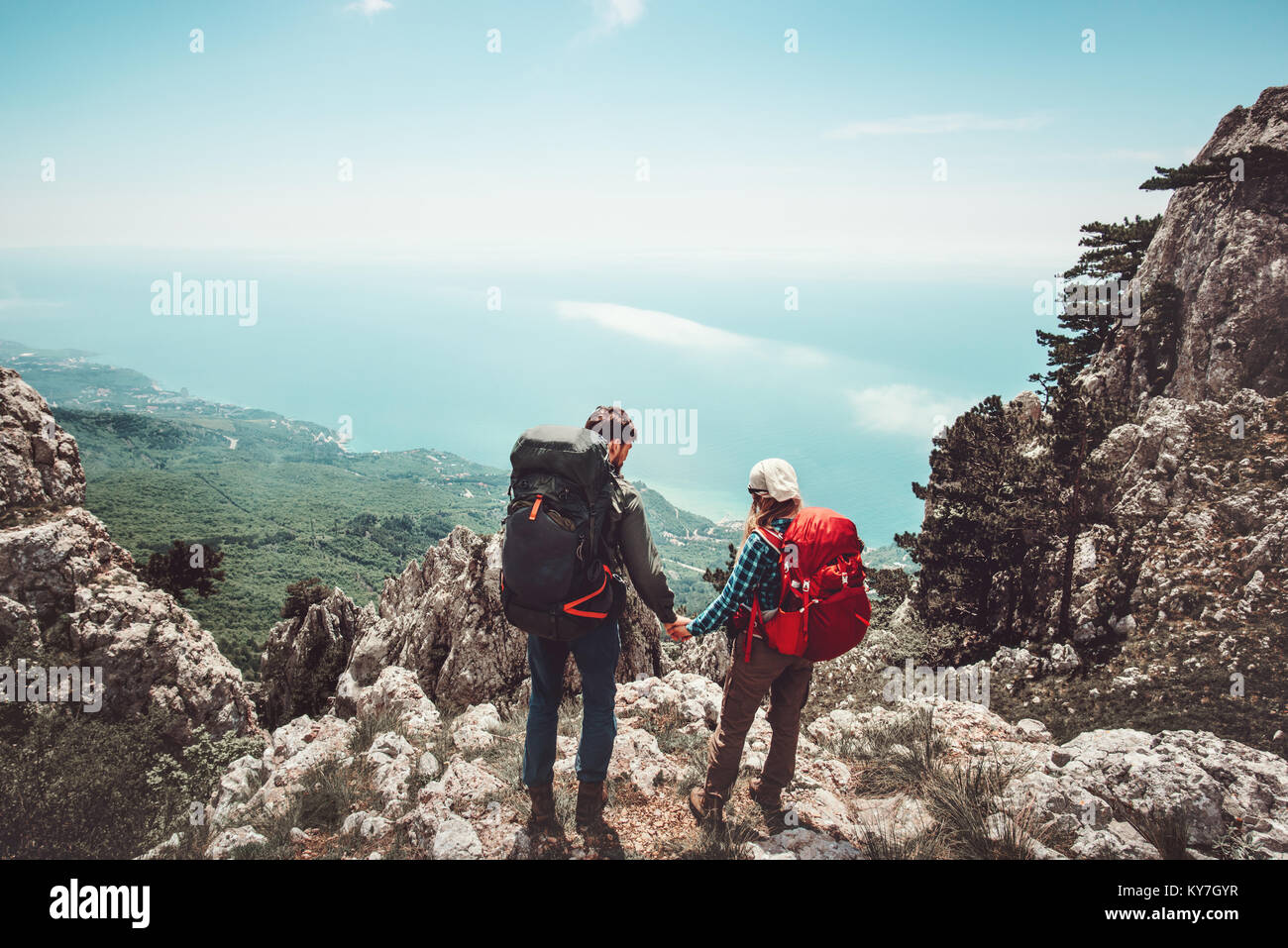 Couple travelers Man and Woman holding hands enjoying mountains aerial ...