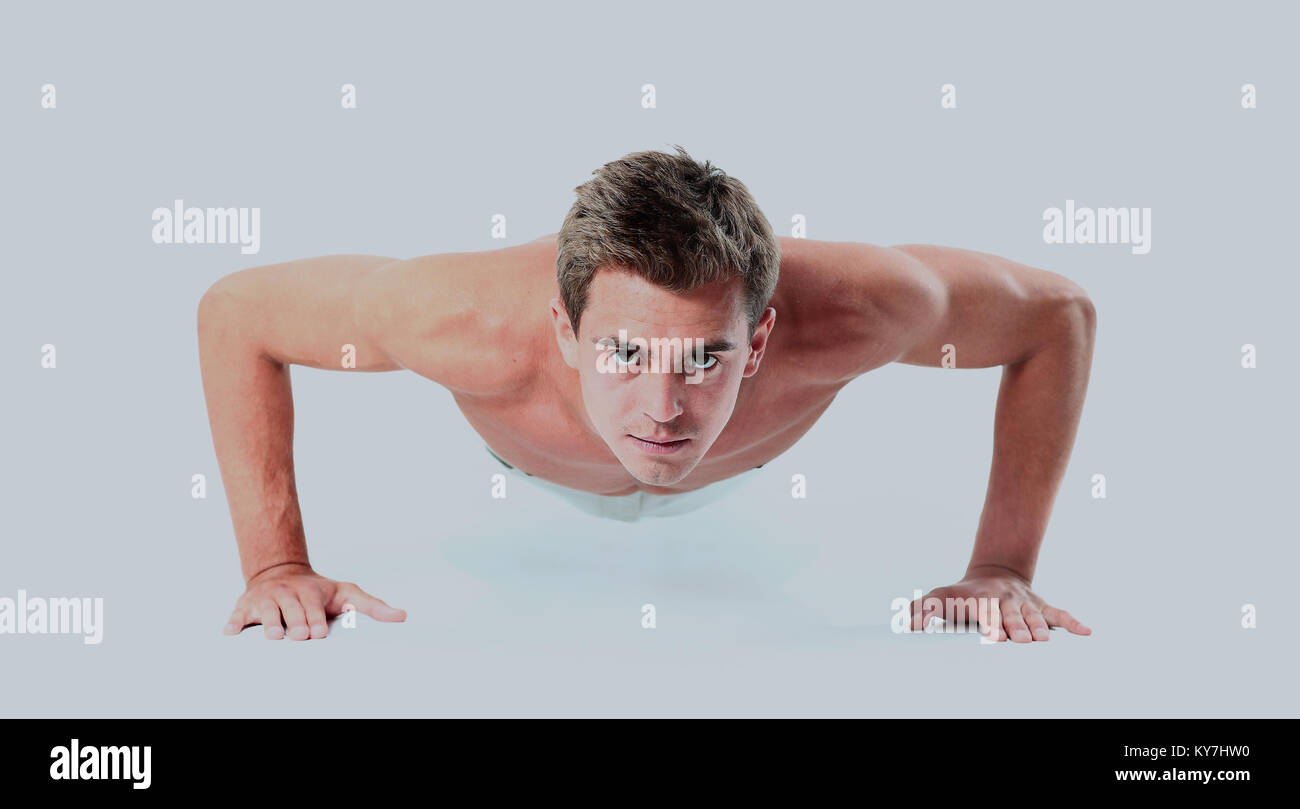 Young man doing push up exercise Stock Photo - Alamy