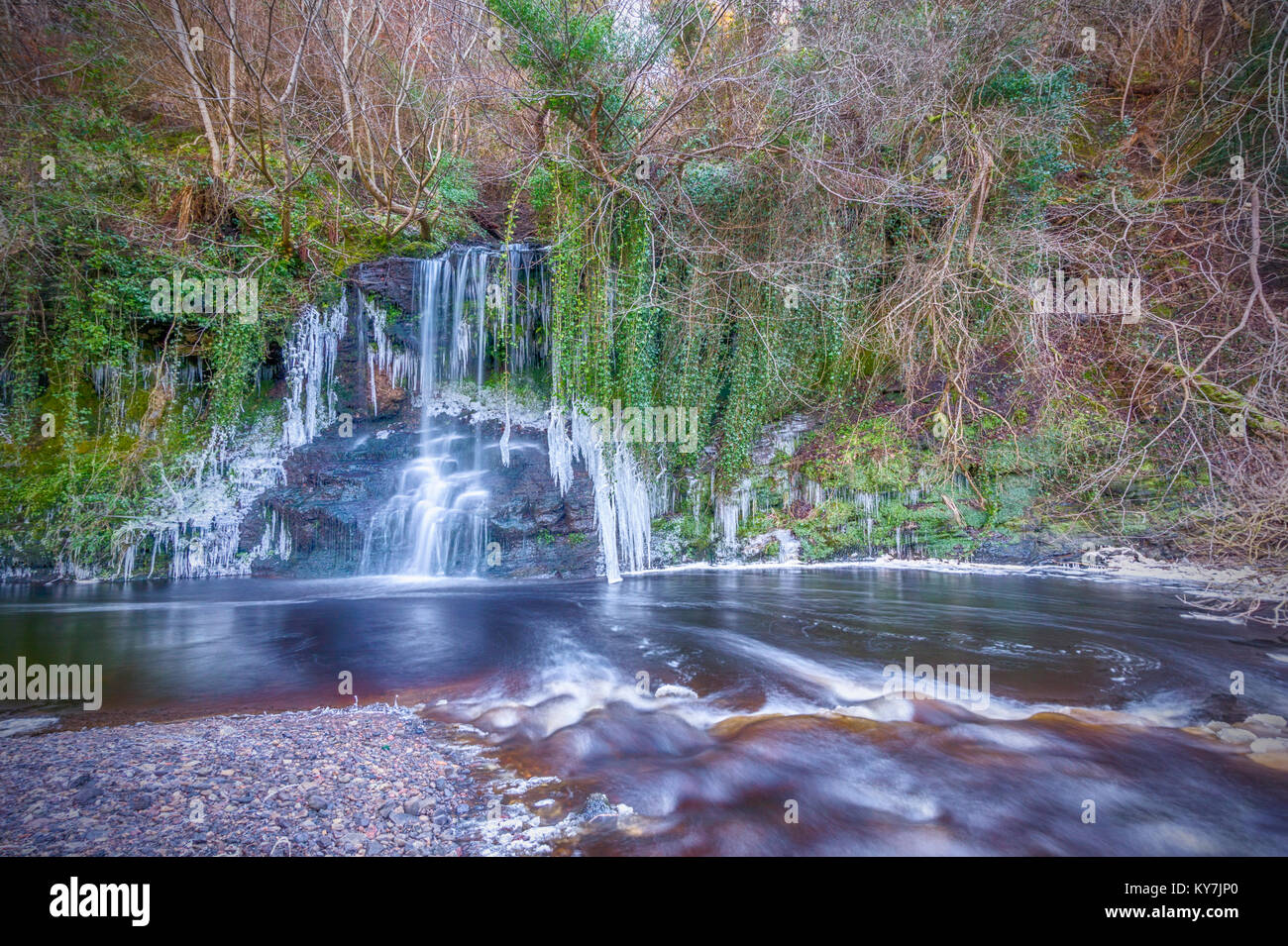 This waterfall sits in a gorge in Calderwood Country Park, between East and Mid Calder, West Lothian.The river in the foreground is the Linhouse Water Stock Photo