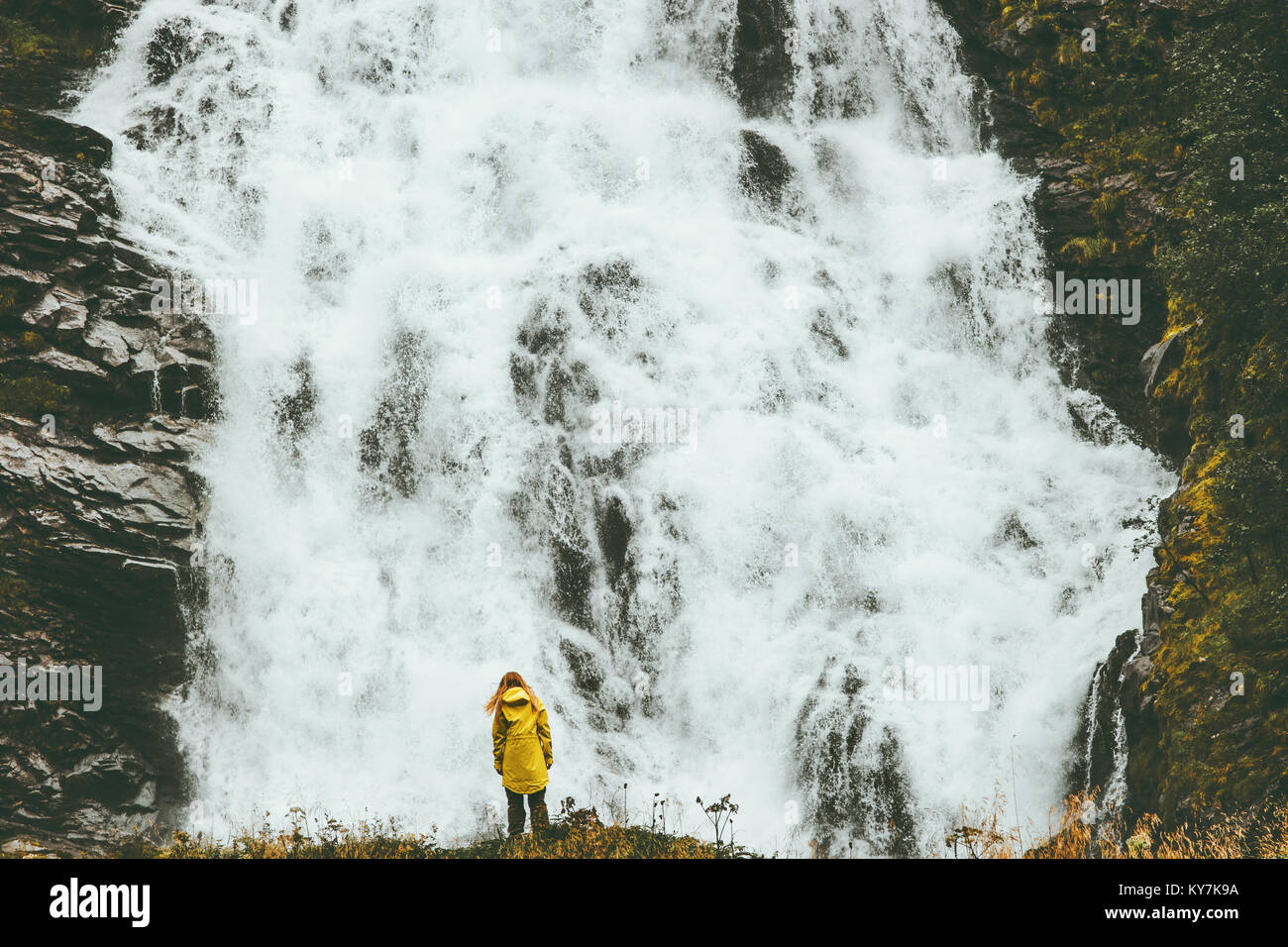 Woman enjoying big waterfall landscape view outdoor Travel Lifestyle ...