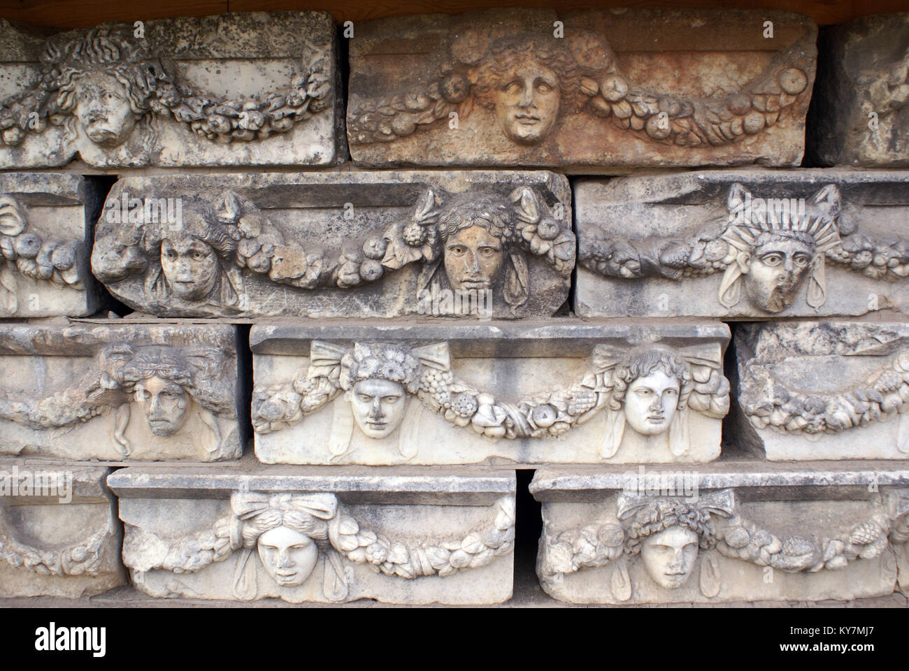 Theatre masks on the wall in Aphrodisias Stock Photo