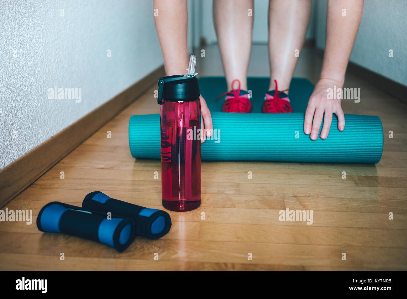 Woman Preparing For Workout At Home With Dumbbells Yoga Mat And