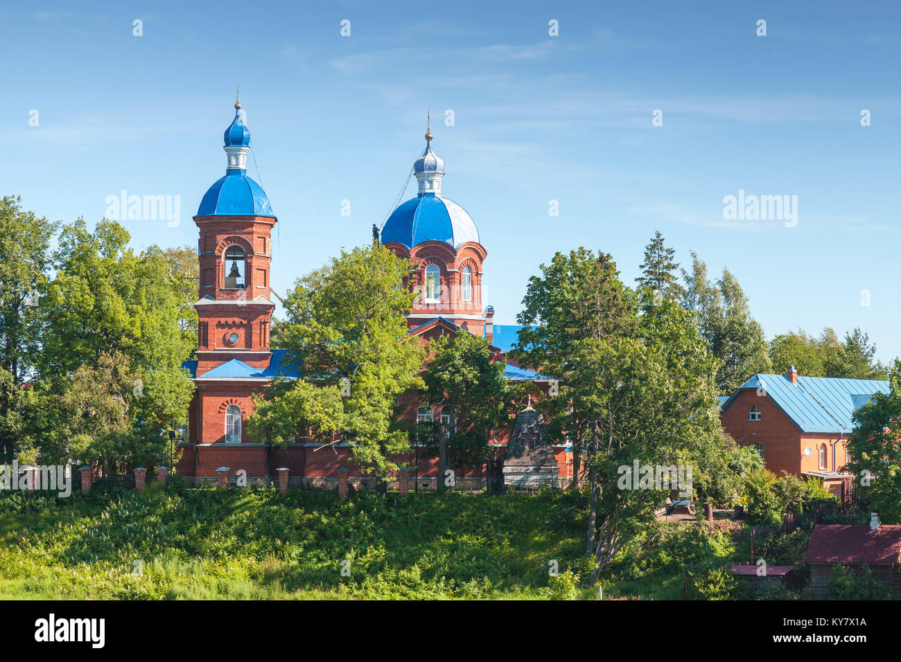 Rozhdestveno, Russia - July 11, 2014: Church of the Nativity of the Blessed Virgin Mary on summer day, worker repairs roof Stock Photo