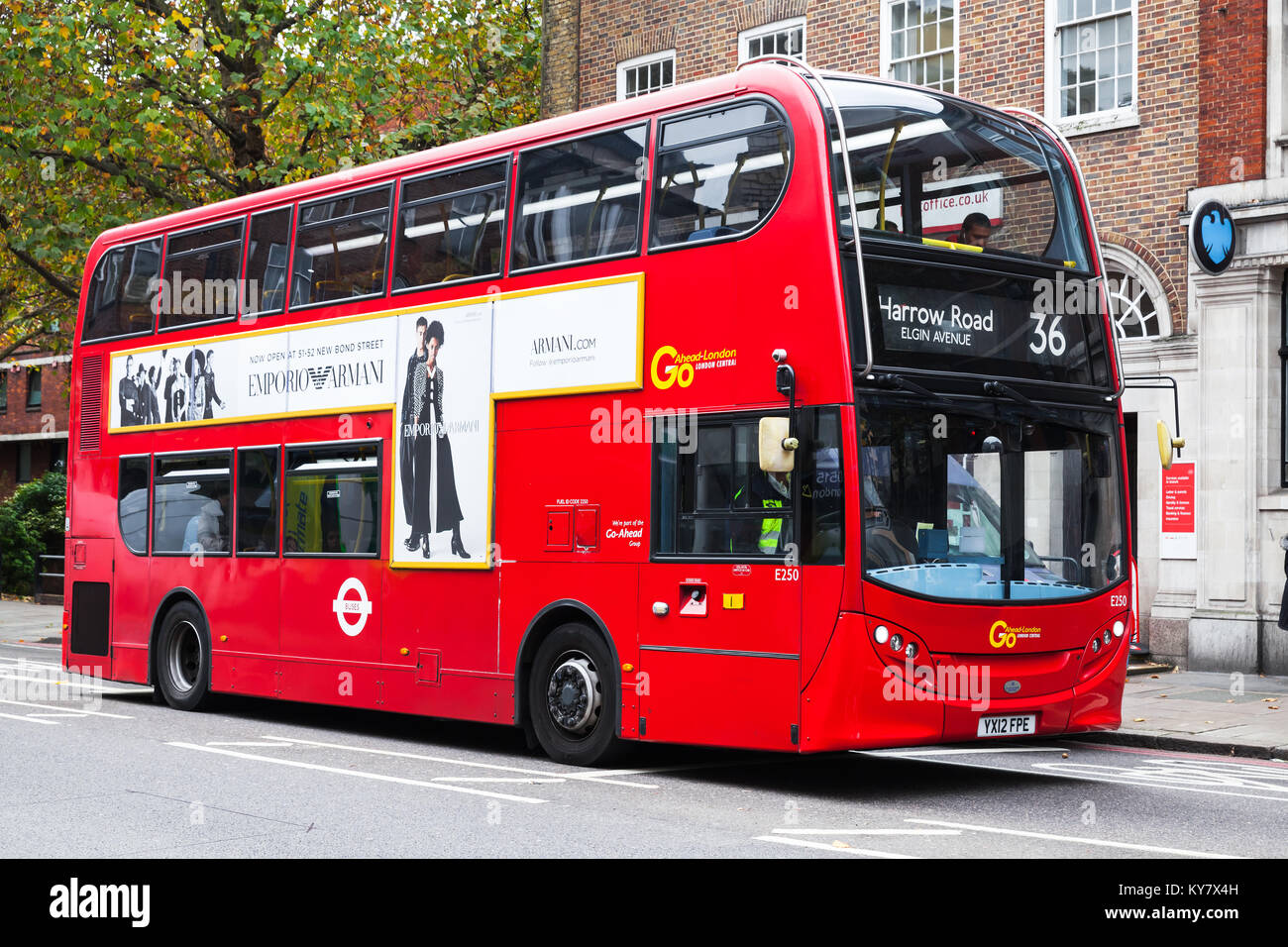London, United Kingdom - October 31, 2017: Modern Red double-decker bus with ordinary passengers is going down the street of London city Stock Photo