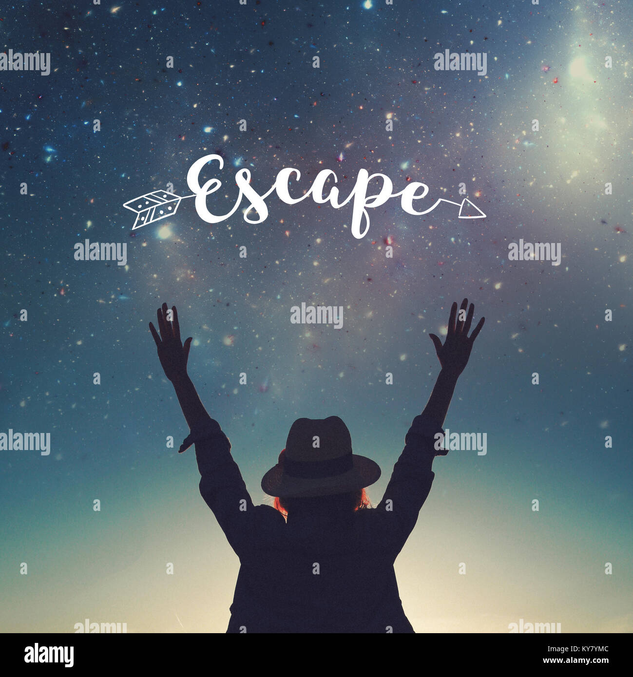 Carefree woman in hat silhouette hands up in the air to the stars, escape concept Stock Photo