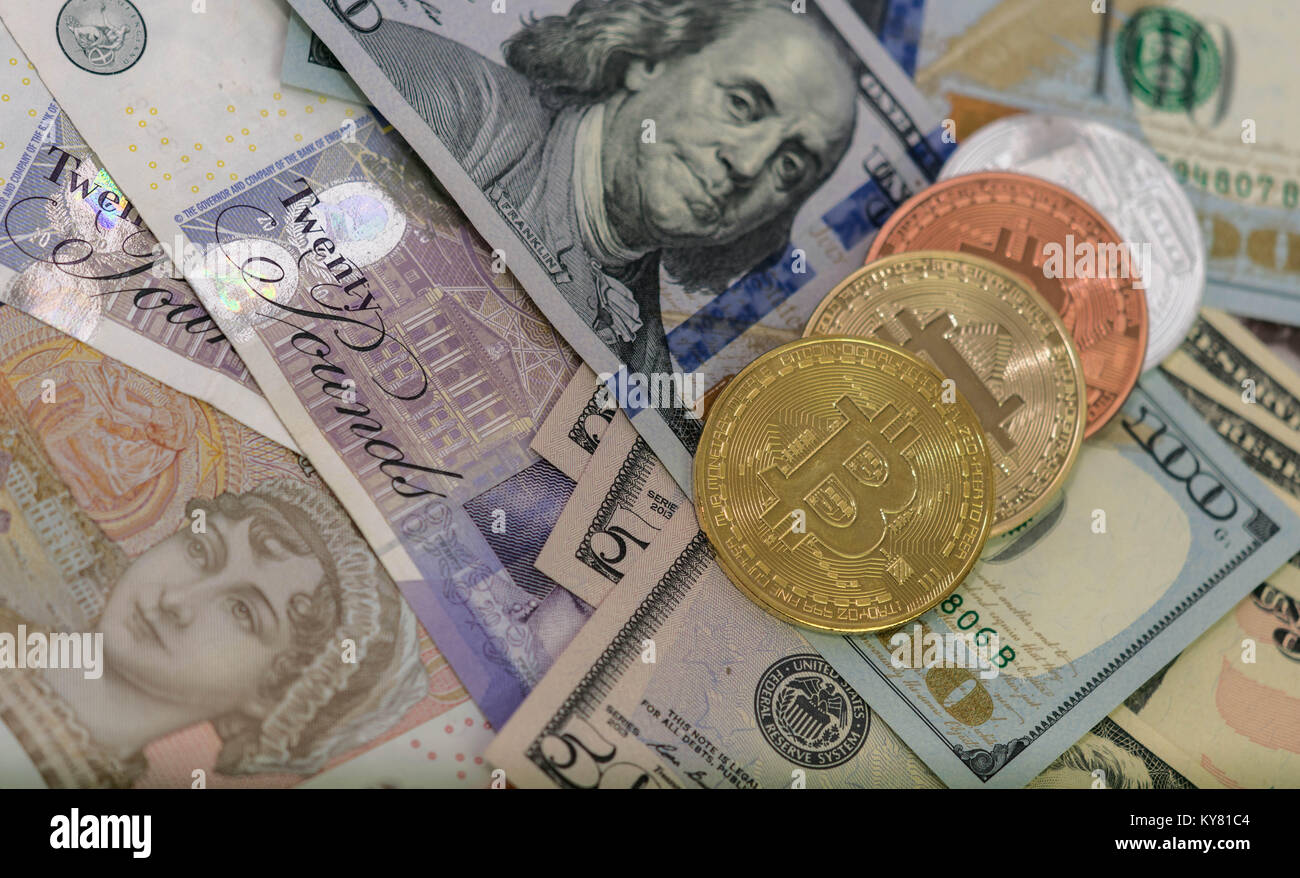 Bitcoins with US banknotes and british banknotes, 20 pounds sterling, 10  pound sterling notes. golden bitcoin, silver bitcoin, bronze bitcoin Stock  Photo - Alamy