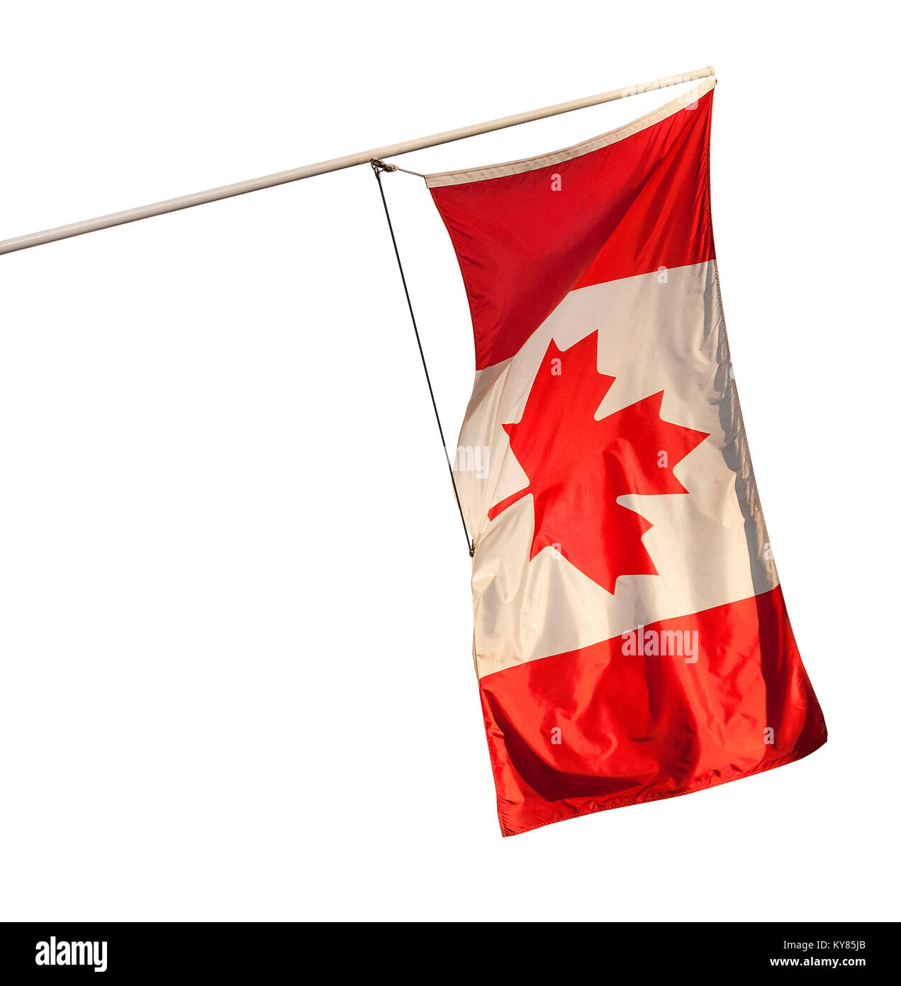 Canadian flag flying from an angled wall-mounted pole, isolated on a white backfround. Stock Photo