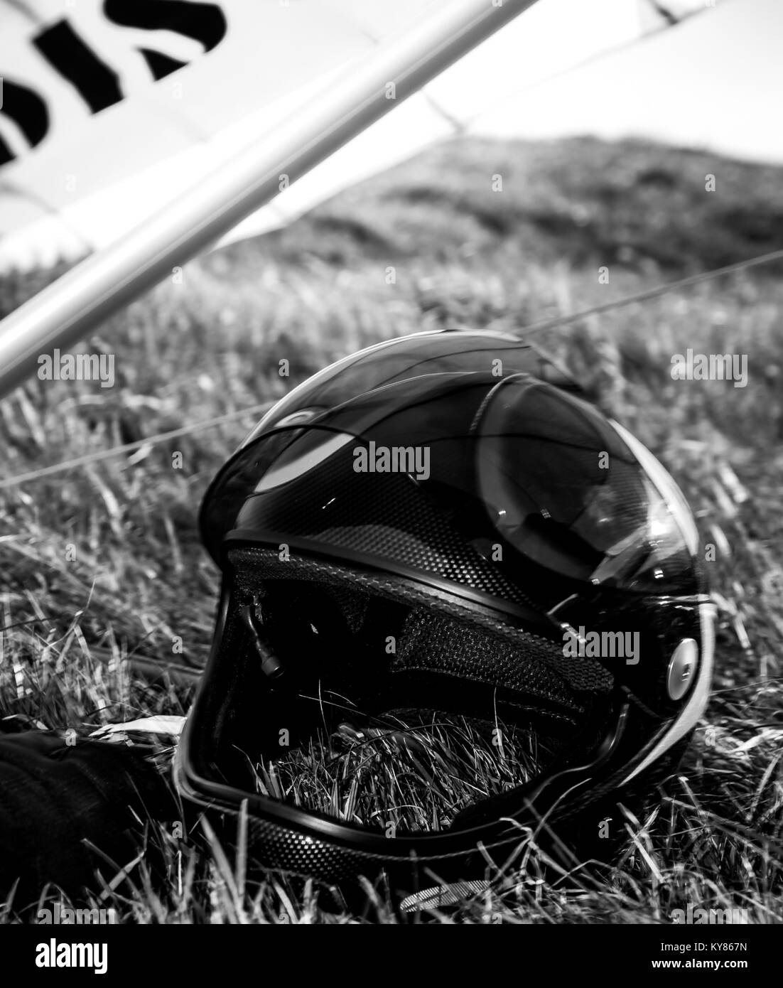 Hang gliders helmet on grass Stock Photo
