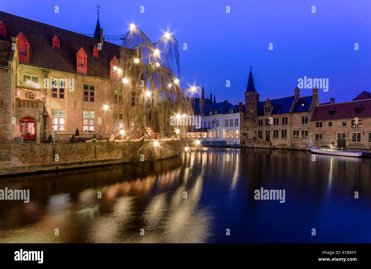 Rozenhoedkai in bruges  Belgium decorated in christmas lights in December 2017. The blue color in sky adding to christmas vibe Stock Photo